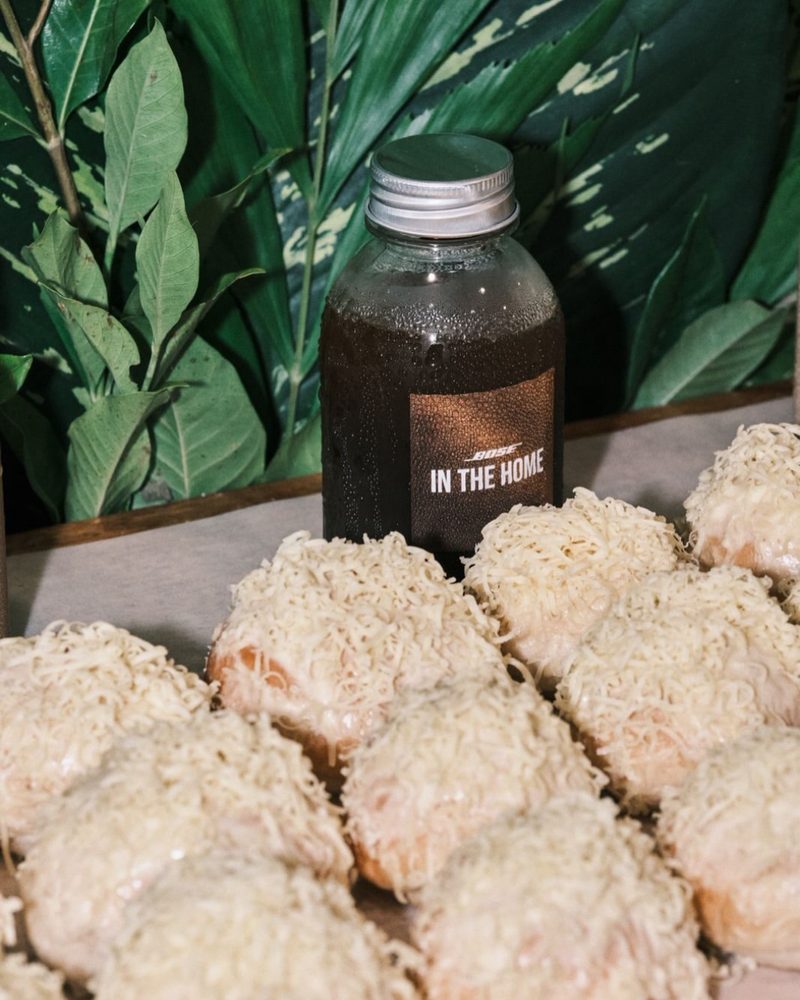 custom labeled bottle beside event snacks